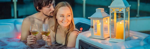BANNER, LONG FORMAT Portrait of young carefree happy smiling couple relaxing at hot tub during enjoying happy traveling moment vacation life against the background of green big mountains — Stock Photo, Image