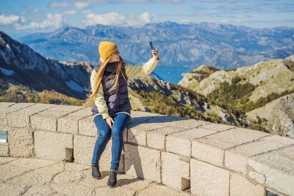 Woman traveller in mountain landscape at national park Lovcen, Montenegro. Travel to Montenegro concept — ストック写真