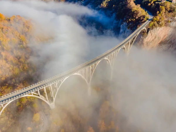 Montenegro. Dzhurdzhevich Bridge Over The River Tara foggy morning — ストック写真