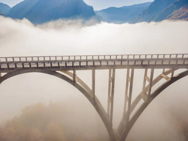 Montenegro. Dzhurdzhevich Bridge Over The River Tara foggy morning — ストック写真
