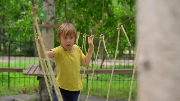 Happy Child Yellow Teashirt School Boy Enjoys Activity Climbing Adventure — Stock Video