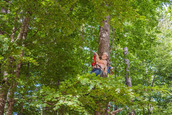 Happy Women Girl Female Gliding Climbing Extreme Road Trolley Zipline — Fotografia de Stock