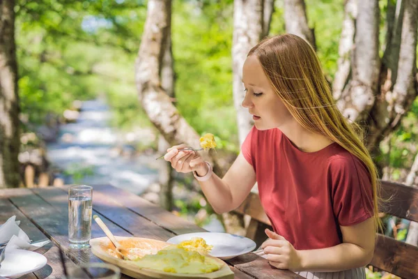 Woman Tourist Eating Traditional Montenegrin Meal Kacamak Wooden Bowl Outdoor — Foto Stock