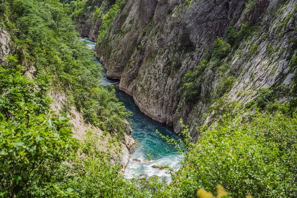 The purest waters of the turquoise color of the river Moraca flowing among the canyons. Travel around Montenegro concept.