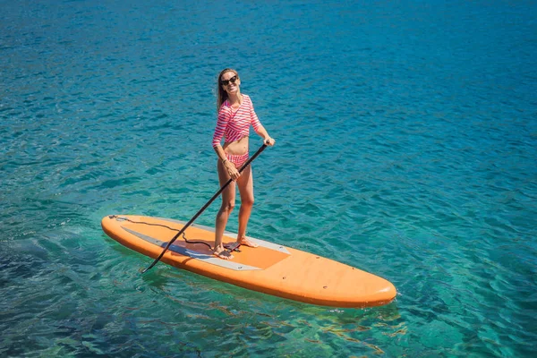 Young Women Having Fun Stand Paddling Blue Water Sea Montenegro — Stockfoto