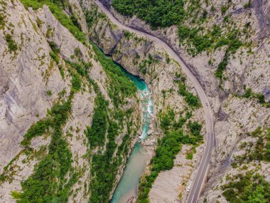 The purest waters of the turquoise color of the river Moraca flowing among the canyons. Travel around Montenegro concept.