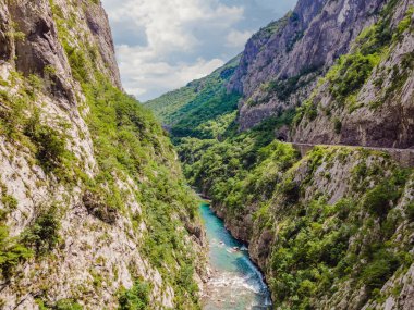 The purest waters of the turquoise color of the river Moraca flowing among the canyons. Travel around Montenegro concept.