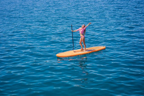 Young Women Having Fun Stand Paddling Blue Water Sea Montenegro — Stockfoto