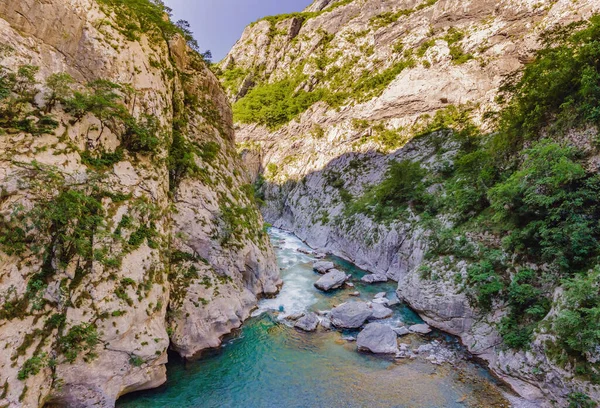 The purest waters of the turquoise color of the river Moraca flowing among the canyons. Travel around Montenegro concept.