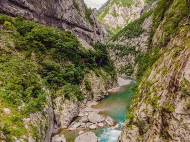 The purest waters of the turquoise color of the river Moraca flowing among the canyons. Travel around Montenegro concept.