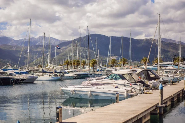 Yacht marina, beautiful Mediterranean landscape in warm colors. Montenegro, Kotor Bay, Tivat city. Porto Montenegro marina view. Go Everywhere.