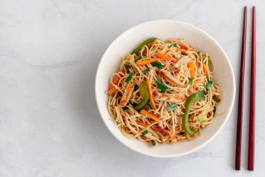 Simple Chicken Chow Mein with Chopsticks Top Down Photo on White Background