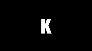 White picture of K on a black background. american alphabet. english language for writing. Dynamic style footage for your project. 4K video animation for motion graphics and compositing