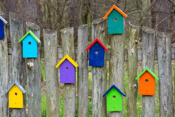 Wooden Fence Decorative Elements Form Multicolored Stylized Birdhouses Colored Decorative — стоковое фото