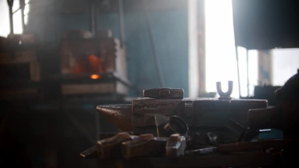 Blacksmith workshop - a hammer laying on the anvil — Stock Video
