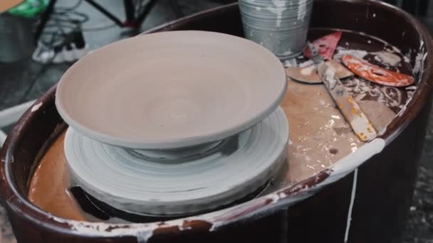 Pottery - dried ceramic plate spins on on the wheel — Video