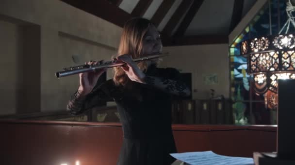 Flutist and organist playing music in christian church — Vídeo de Stock
