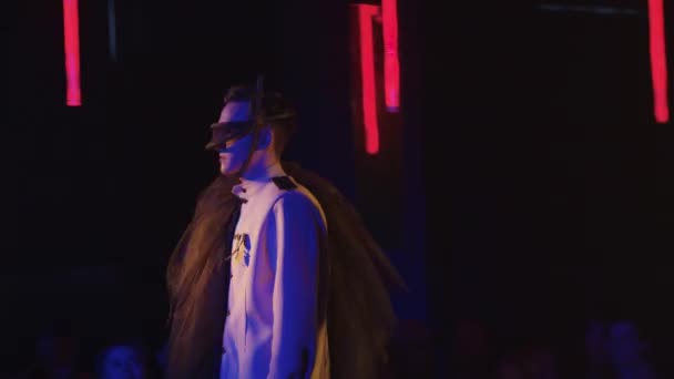 RUSSIA, KAZAN 20-02-2022: costume party in the club - a young man walks on the stage — Stockvideo