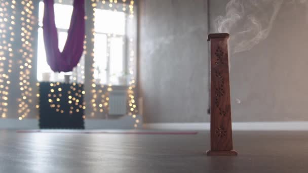 Smoldering incense in wooden stand — Stock Video
