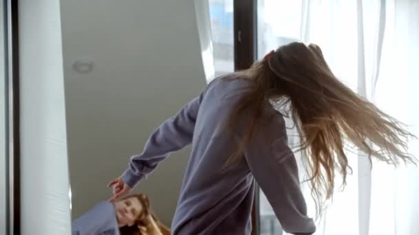 Young pretty woman with long hair dancing in front of the mirror in the room — Stock Video