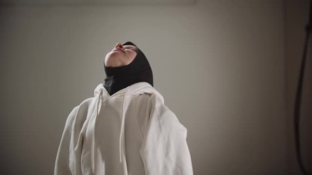 Yoga indoors - young woman in hijab doing exercises for her back and spine — Stock Video