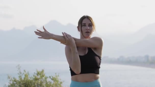 Fitness Outdoors Young Woman Warming Her Hands Mid Shot — Stock Video