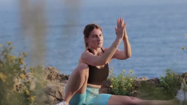 Sports Outdoors Woman Doing Stretching Exercises Sea Mid Shot — Stock Video