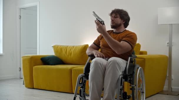Man Wheelchair Playing Blank Guns Mid Shot — 图库视频影像