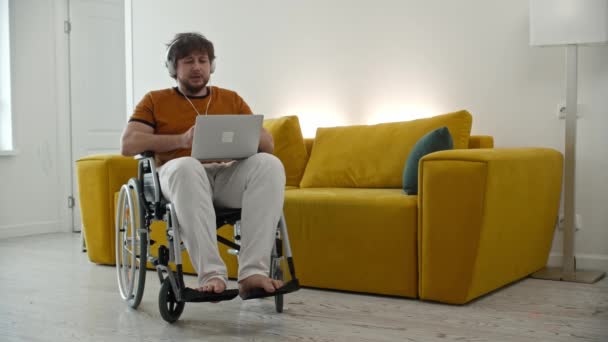 Man Freelancer Sitting Wheelchair Having Videocall His Laptop Mid Shot — Wideo stockowe