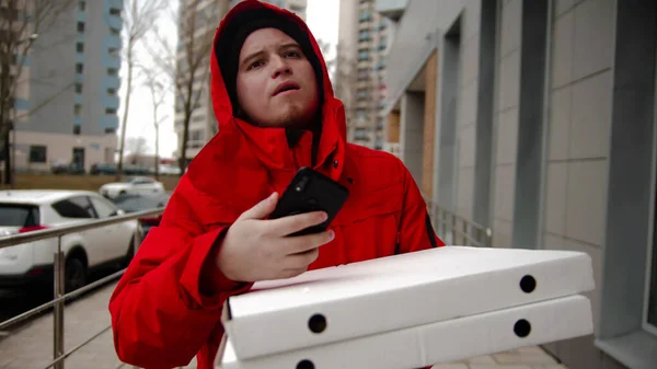 Man Courier Delivering Pizza Walking Street Holding Phone Mid Shot — Fotografia de Stock