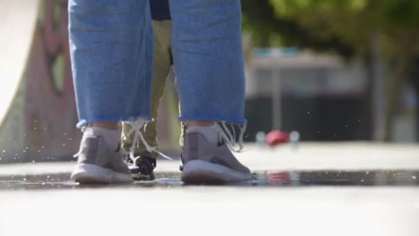 Little Boy His Mother Jumping Puddle Mid Shot — Stockvideo