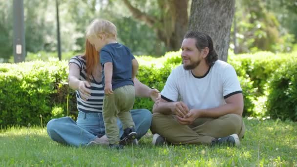 Family Spend Time Park Sitting Grass Mother Hugging Her Son — Vídeo de Stock