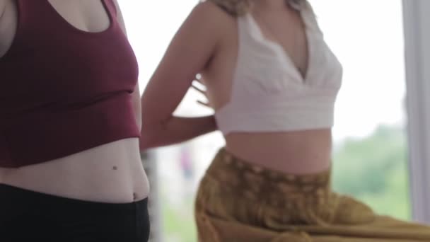 Women Doing Yoga Studio Standing Hands Backs Puts Leg Mid — Stock video