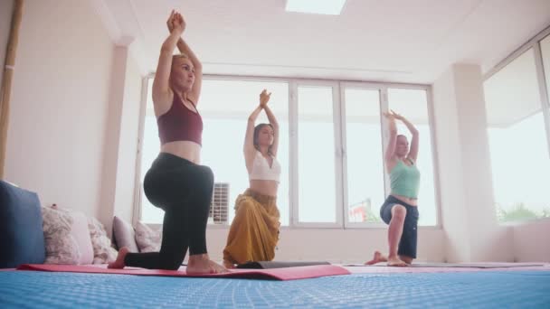 Three Women Standing Yoga Mats Knees Doing Exercises Mid Shot — Stock video