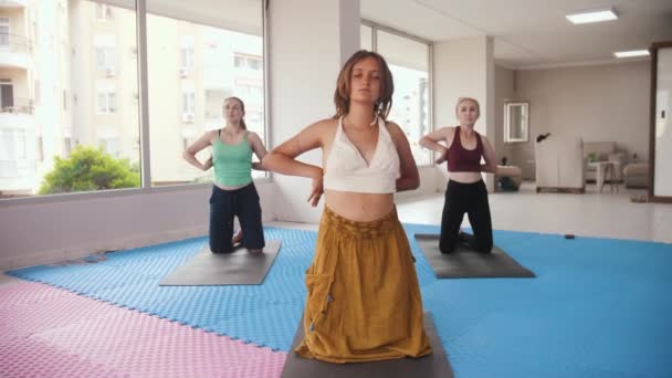 Three Women Having Yoga Classes Studio Younger One Stands Front — Video
