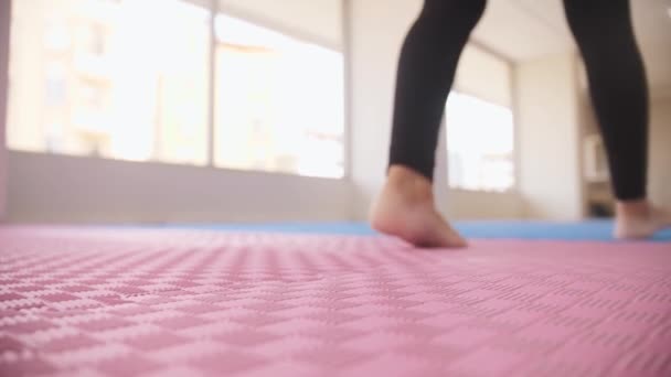 Women Walks Studio Brings Yoga Mats Them Mid Shot — Vídeos de Stock