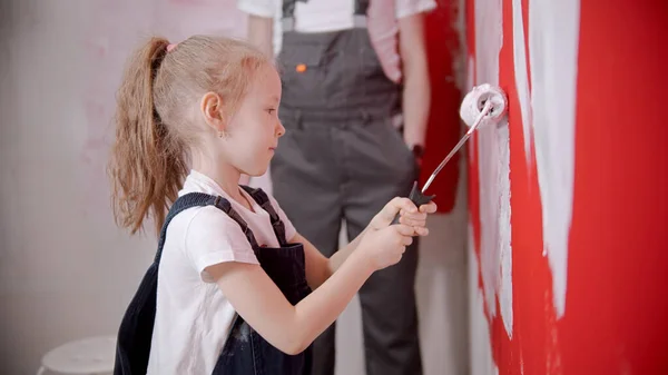 Little Girl Painting Wall Paint Roller Mid Shot — Stockfoto