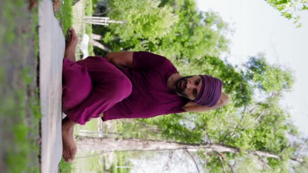 Arabian Man Running Yoga Class Sits Tightly Crossed Position Gets — стоковое видео