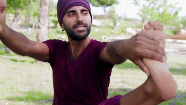 Arabian Man Doing Yoga Holding His Foot Stretching His Hand — Stockvideo