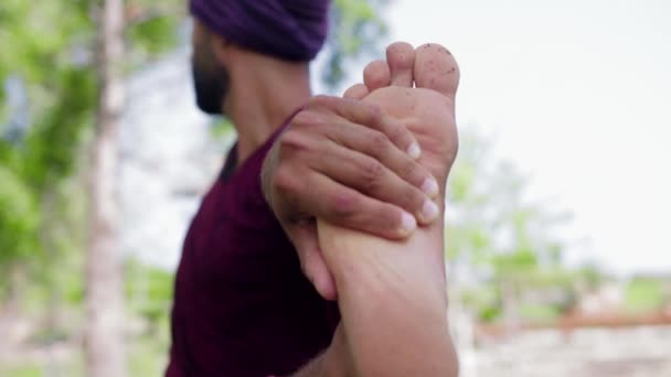 Arabian Man Doing Yoga Outdoors Holding His Foot Stretching His — Vídeos de Stock