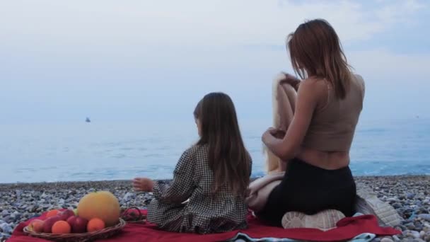 Little Girl Having Picnic Her Mother Sea Mother Puts Blanket — Stockvideo