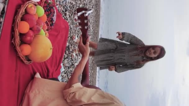 Woman Playing Guitar Sea Her Little Daughter Dancing Picks Berry — ストック動画