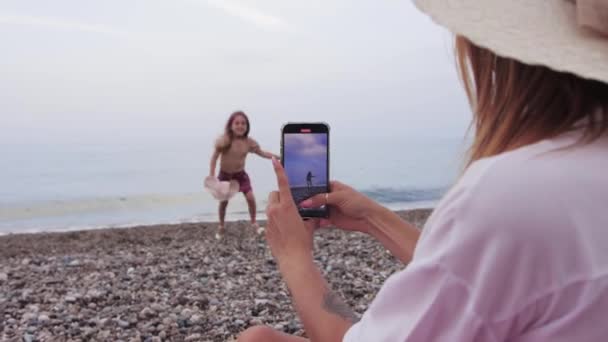 Woman Filming Her Little Daughter Sea Her Phone Mid Shot — Stock Video