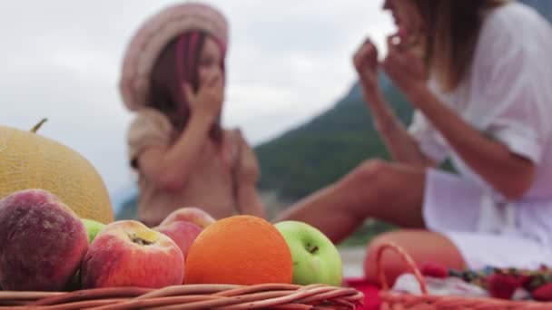 Young Mother Her Little Daughter Having Picnic Fruits Mid Shot — Stock Video