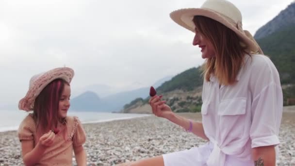 Young Mother Her Little Daughter Having Picnic Eating Berries Beach — Stock Video