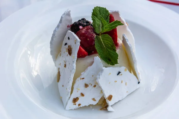 Pavlova cake, a meringue-based dessert named after the Russian ballerina Anna Pavlova, in Russia.