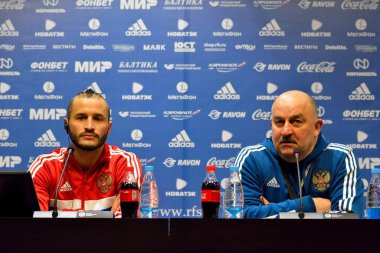 Moscow, Russia - March 22, 2018. Russian national football team coach Stanislav Cherchesov and defender Fedor Kudryashov at a press conference ahead of international test match against Brazil at Luzhniki stadium in Moscow. 