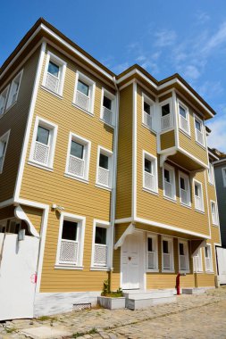 Istanbul, Turkey - April 23, 2017. Recreations of the prim Ottoman-style houses along cobbled Sogukcesme Sokak in Istanbul.