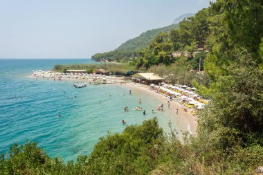 Akyaka, Mugla, Turkey - July 30, 2016. Cinar beach near Akyaka village in Mugla province of Turkey, with people.