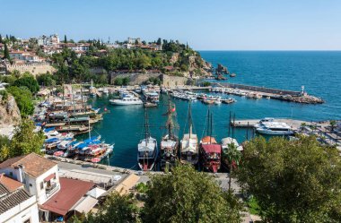 Antalya, Turkey - August 31, 2016. View over the harbour and historic district Kaleici in Antalya, Turkey, with boats, people and historic buildings.